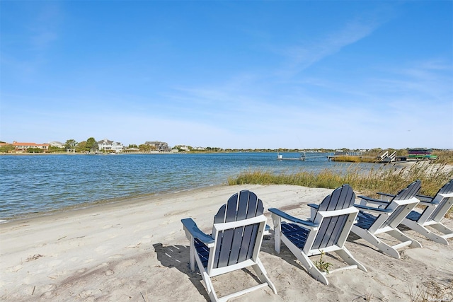 view of patio / terrace featuring a water view and a view of the beach