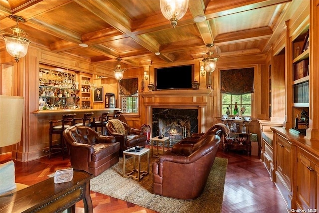 living room featuring wood walls, built in features, and wooden ceiling