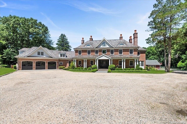 colonial inspired home featuring a garage