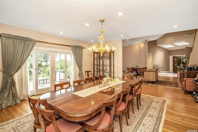 dining room with a chandelier and light wood-type flooring