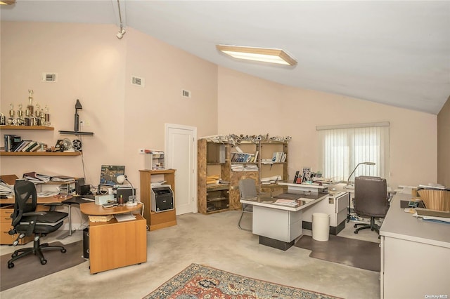 carpeted office space featuring high vaulted ceiling