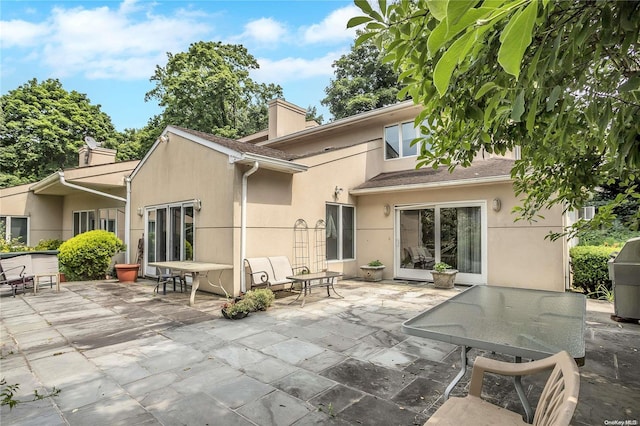 rear view of house featuring a patio