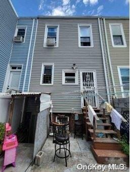 rear view of house featuring a patio