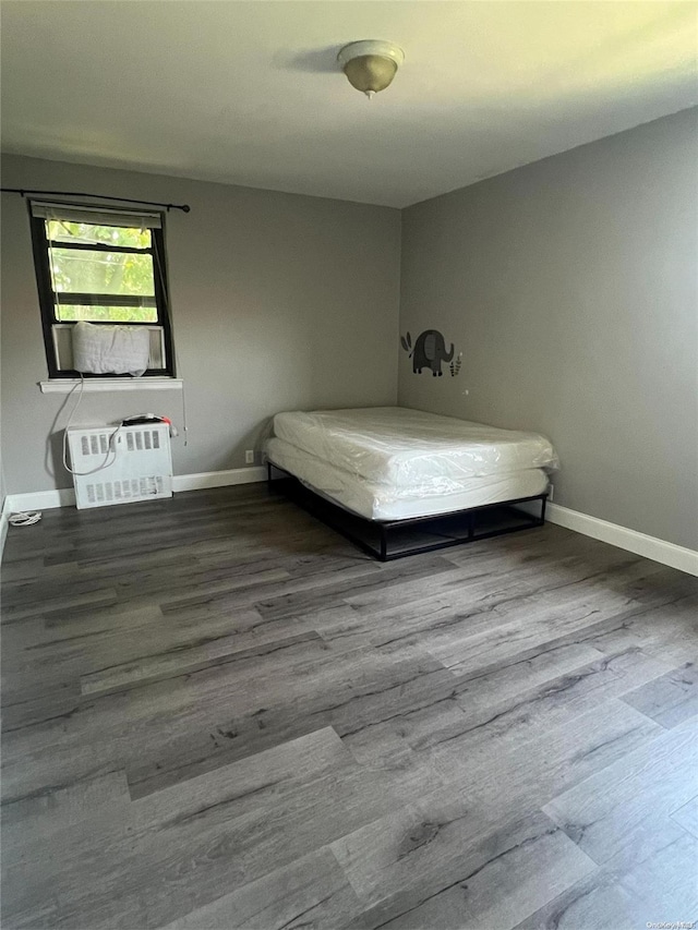 unfurnished bedroom with wood-type flooring