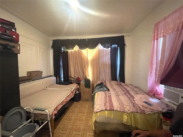 bedroom with light parquet floors