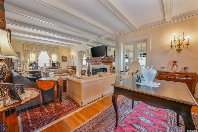 living room with beam ceiling, french doors, and wood-type flooring