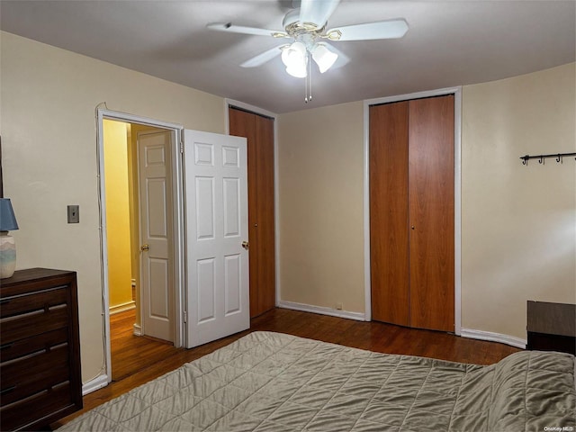 bedroom with hardwood / wood-style floors and ceiling fan