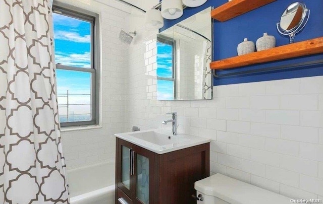 full bathroom with vanity, shower / bathtub combination with curtain, and toilet