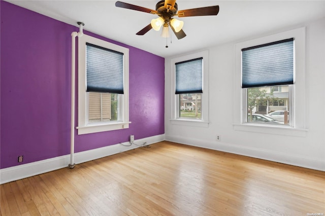 spare room with ceiling fan and light hardwood / wood-style floors