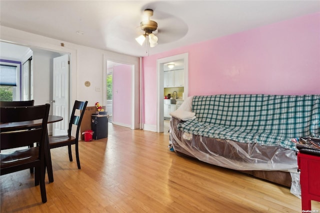 bedroom with hardwood / wood-style floors and ceiling fan