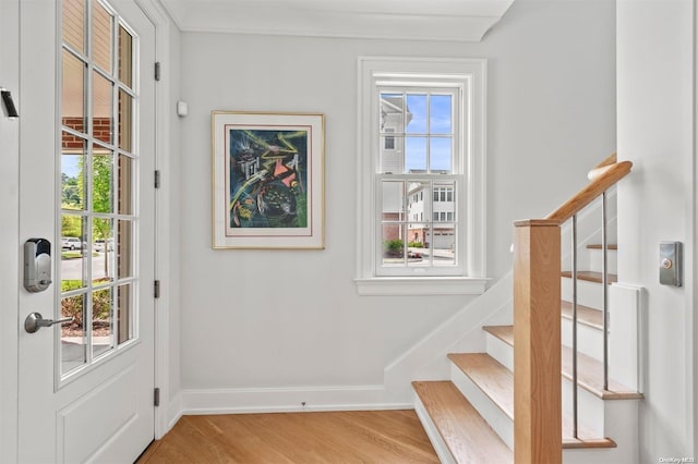 doorway to outside with light hardwood / wood-style flooring and plenty of natural light