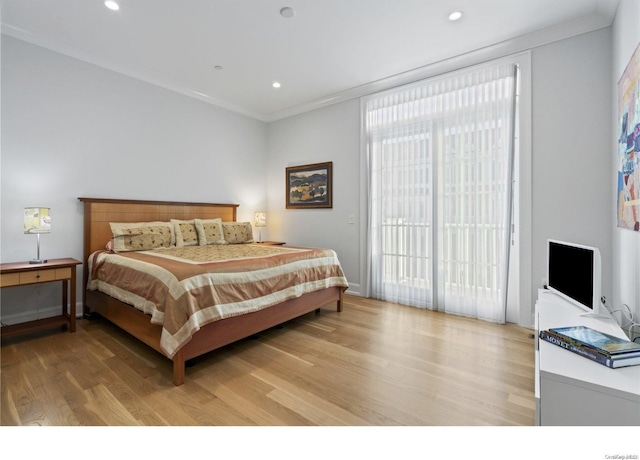 bedroom featuring access to exterior, crown molding, and light hardwood / wood-style flooring