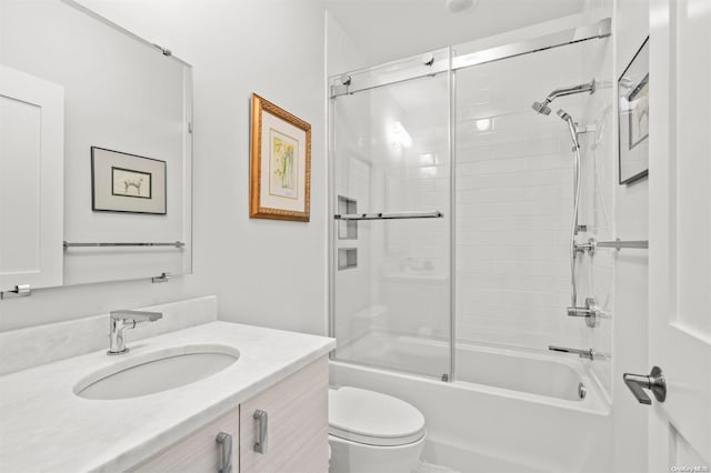 full bathroom with vanity, toilet, and shower / bath combination with glass door