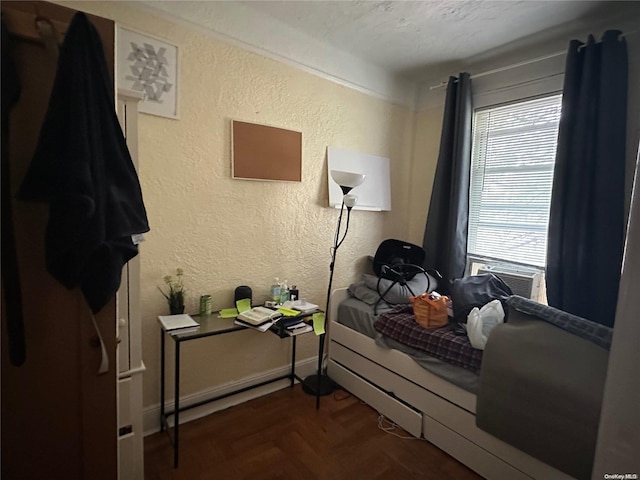 bedroom featuring dark parquet floors