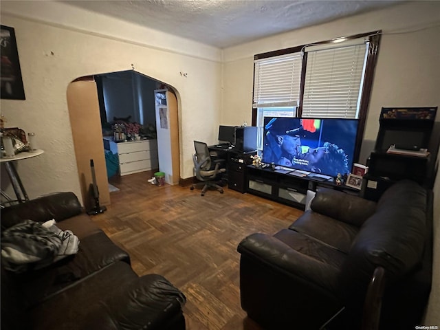 living room featuring parquet flooring