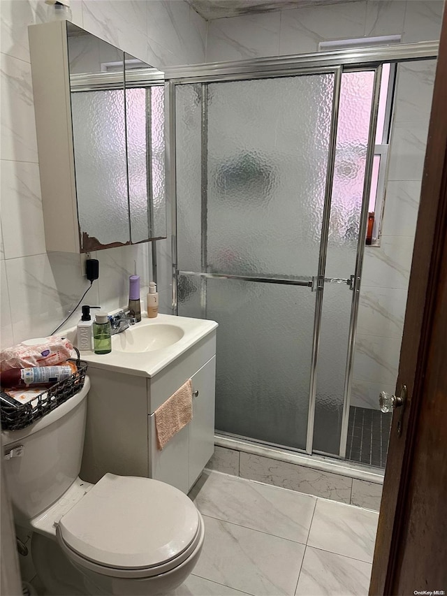 bathroom with vanity, toilet, and walk in shower