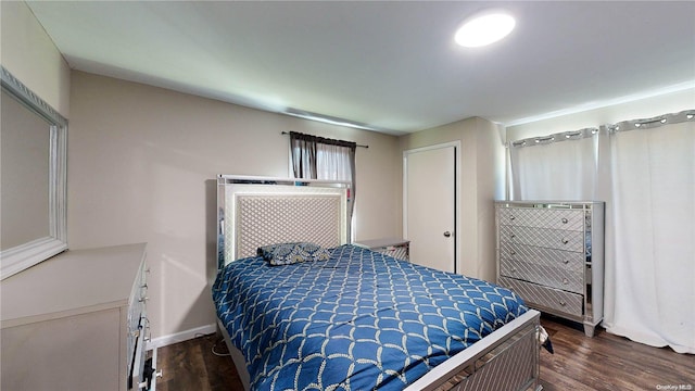 bedroom featuring dark hardwood / wood-style flooring