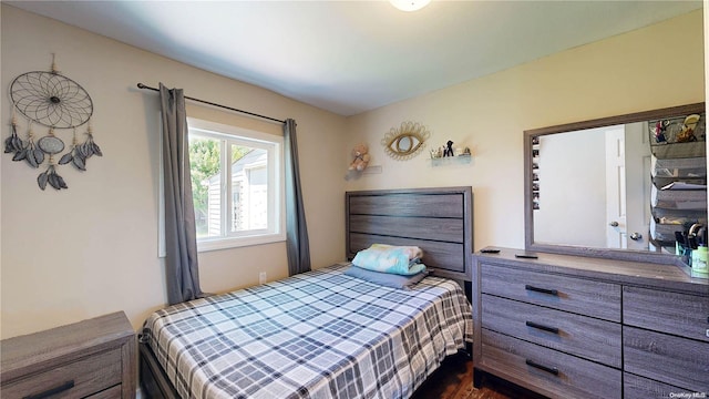 bedroom featuring dark hardwood / wood-style flooring