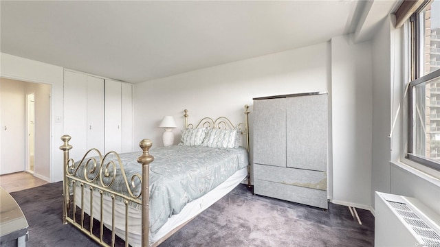 carpeted bedroom with radiator