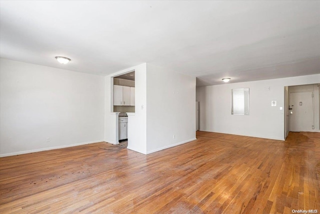 unfurnished living room featuring light hardwood / wood-style floors