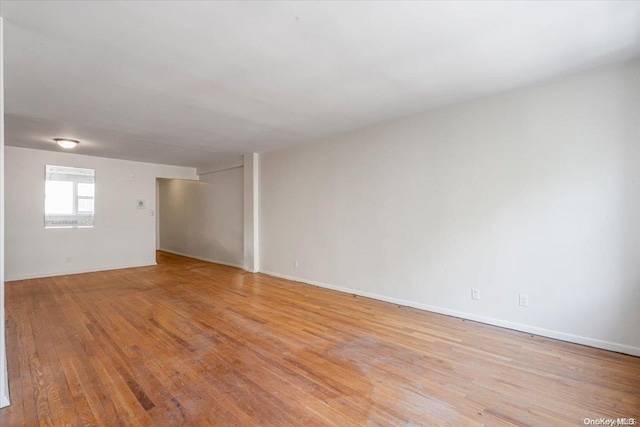 spare room featuring light hardwood / wood-style flooring