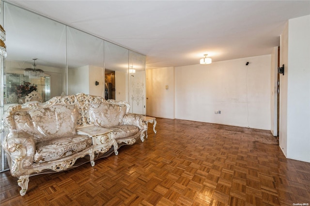 living room featuring dark parquet floors