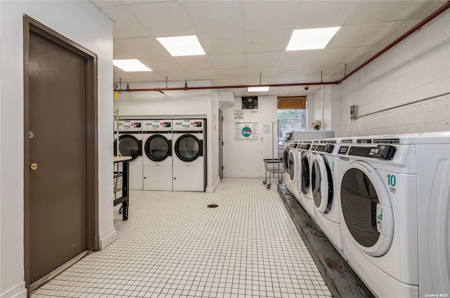 washroom with independent washer and dryer