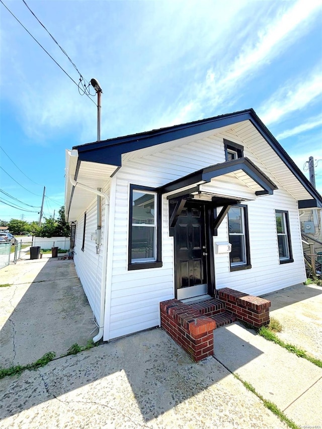 bungalow-style house featuring a patio