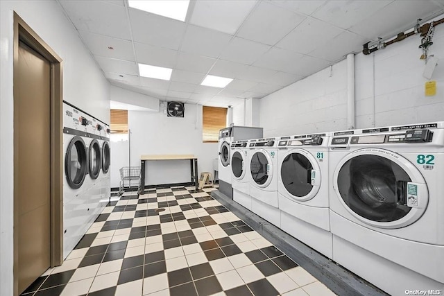 clothes washing area featuring washer and clothes dryer