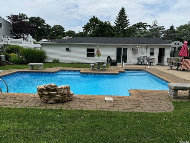 view of pool with a yard and a patio