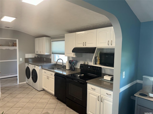 kitchen featuring white cabinetry, sink, baseboard heating, black appliances, and washer and dryer