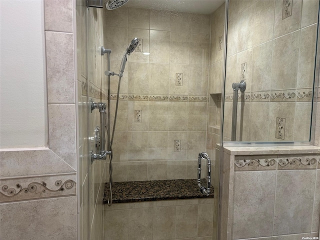 bathroom with a tile shower