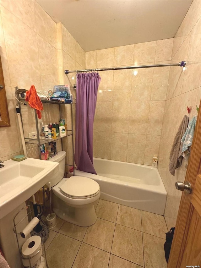 bathroom featuring tile walls, tile patterned flooring, shower / bath combo, and toilet