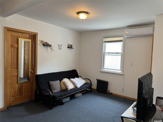 sitting room with dark colored carpet, an AC wall unit, and radiator