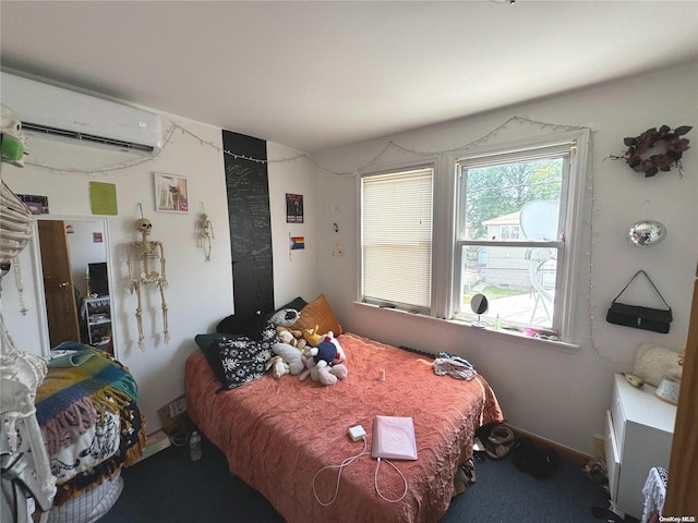 bedroom featuring an AC wall unit