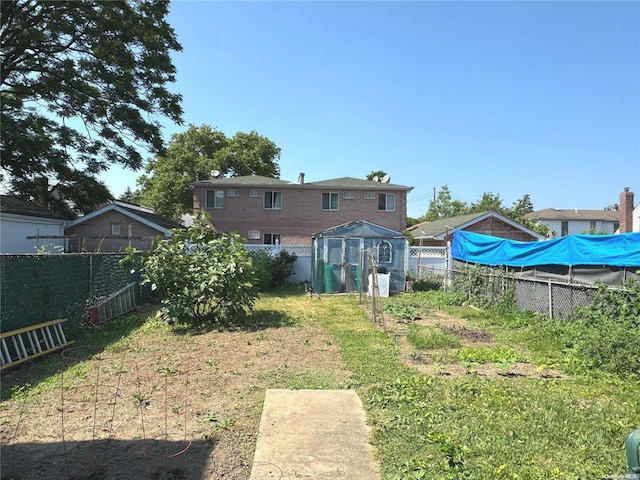 back of property with an outdoor structure