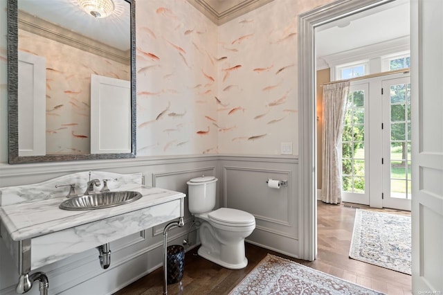 bathroom with vanity, hardwood / wood-style flooring, toilet, and crown molding