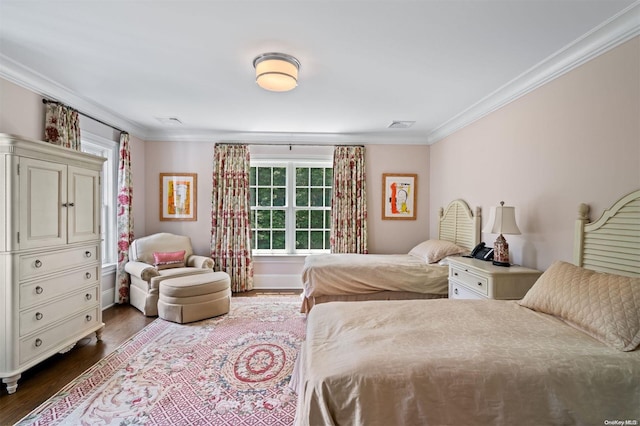 bedroom featuring hardwood / wood-style flooring and crown molding