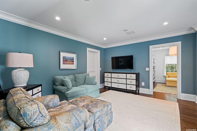 living room with dark hardwood / wood-style floors and crown molding