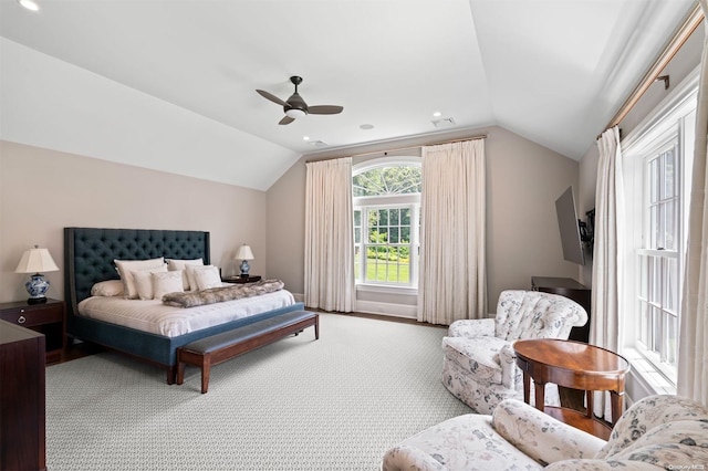 carpeted bedroom featuring vaulted ceiling and ceiling fan