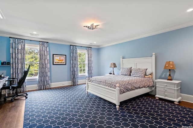 bedroom featuring ornamental molding and dark wood-type flooring