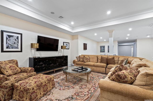 living room featuring decorative columns and ornamental molding