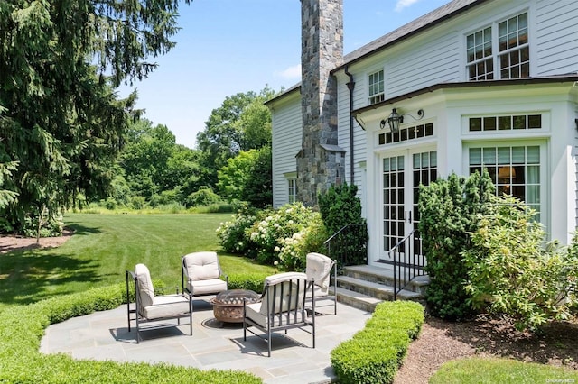 view of patio with an outdoor fire pit