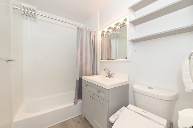 30 Stoner Ave Unit 3R, Great Neck, NY 11021 - bathroom featuring toilet, vanity, shower / tub combo with curtain, and wood finished floors