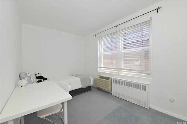 bedroom featuring carpet floors, radiator, and a wall mounted air conditioner