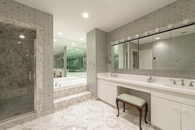 bathroom featuring vanity and shower with separate bathtub