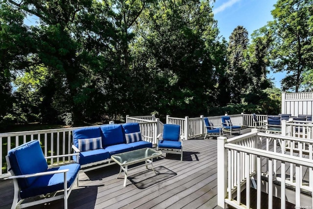 wooden terrace featuring outdoor lounge area