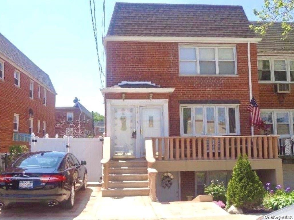 view of front of house featuring a balcony