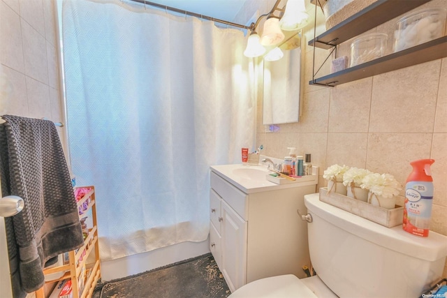 bathroom with backsplash, concrete floors, toilet, vanity, and tile walls