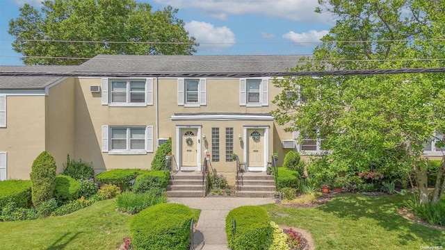 view of front of home with a front lawn